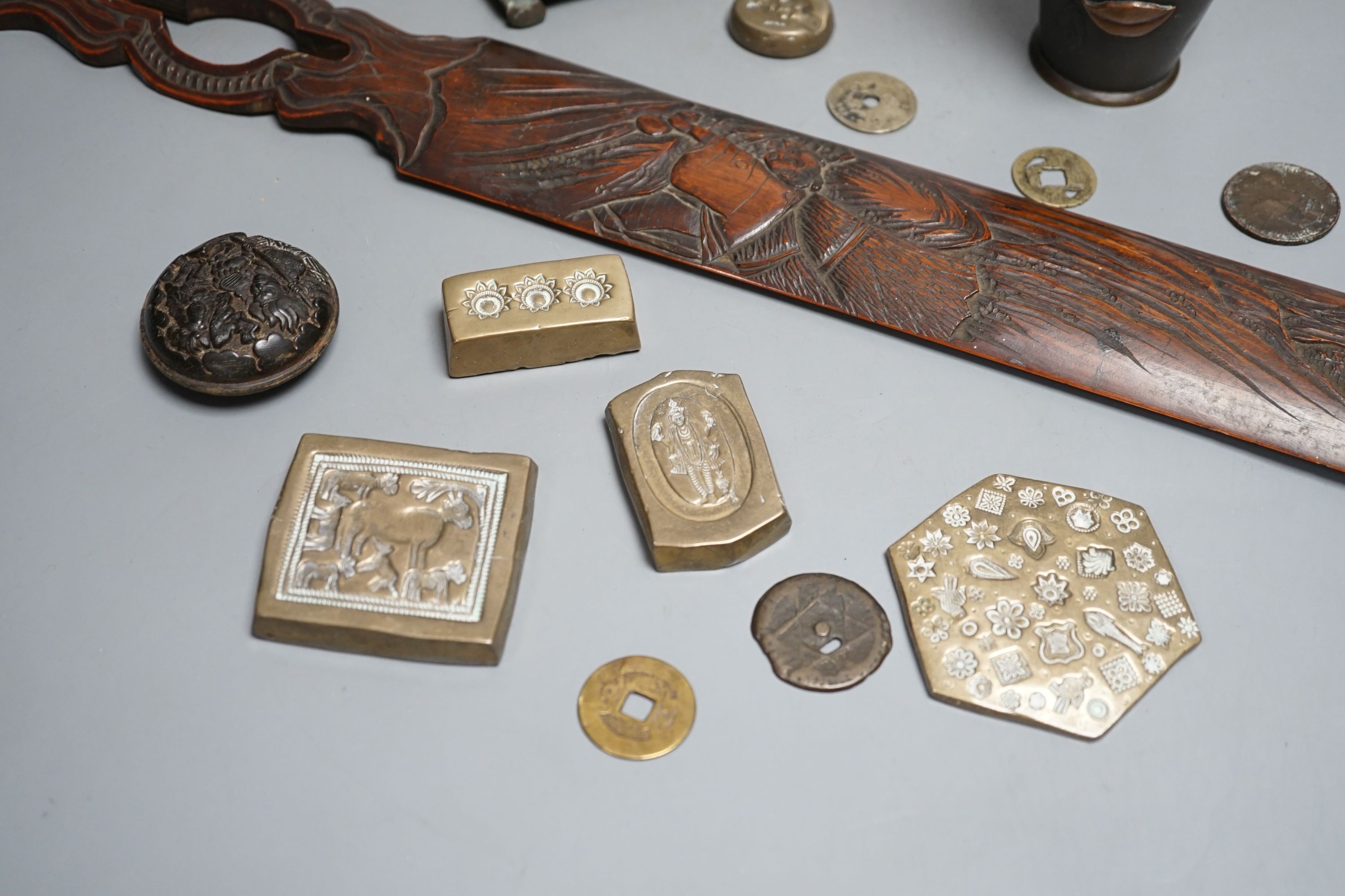 A collection of Japanese and Indian objects, largest page Turner, 46cms long.